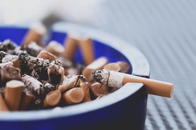 An ash tray filled with used cigarettes