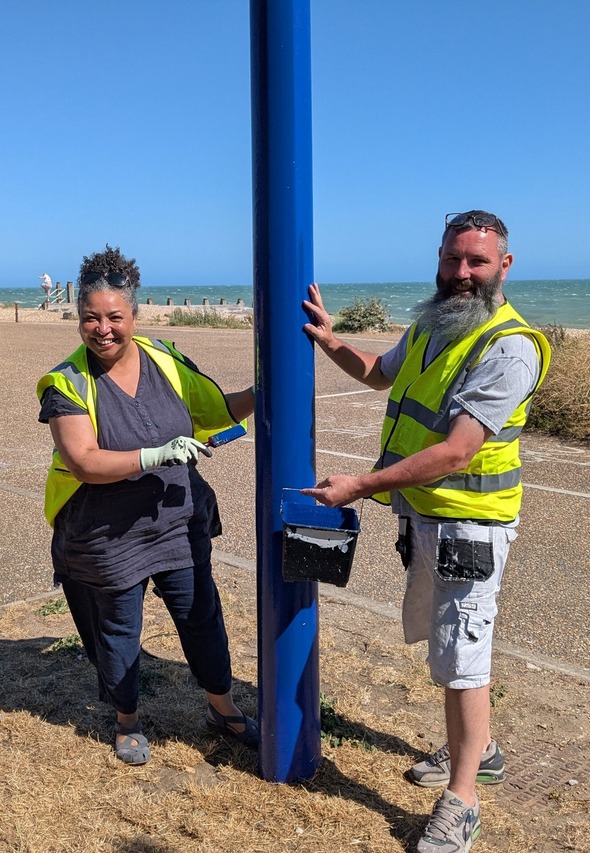 Cllr Jenny Williams lending a hand on the promenade with Steve Munn of SMG contractors