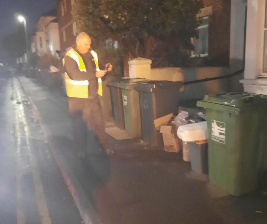 officers locating fly tipping in the dark 