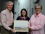 Mike and Marj Harman presenting the Widgery painting to curator Michele Green