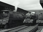 A steam train leaving Exeter St David's station