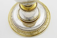 The base of a drinking vessel in gold and silver