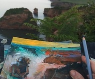 Hands painting a picture