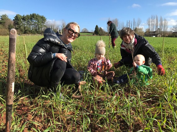 A young family planting trees in the Clyst Valley