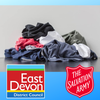 A pile of clothes with the East Devon District Council and Salvation Army logos