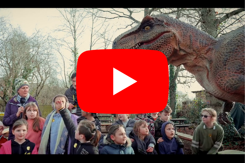 Rexy the dinosaur meets St Martin's Church of England School pupils in Cranbrook