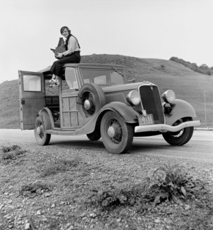 Dorothea Lange, Seated Atop a Ford (1936)
