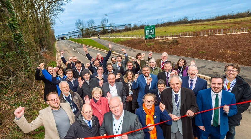 Cllr Arnott cuts a ribbon to open Long Lane, with representatives from other local stakeholders. Photo credit: GRW Photography