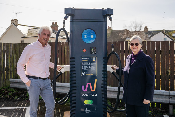 Jose Contreras from Wenea and Councillor Marianne Rixson, EDDC portfolio holder for Climate Action and Emergencies  stood next to an EV charger