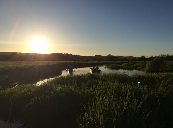 Photo of canoes on the Axe Estuary