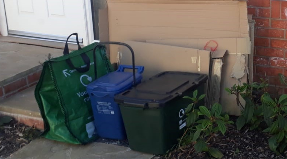 Photo of recycling and waste containers on a doorstep
