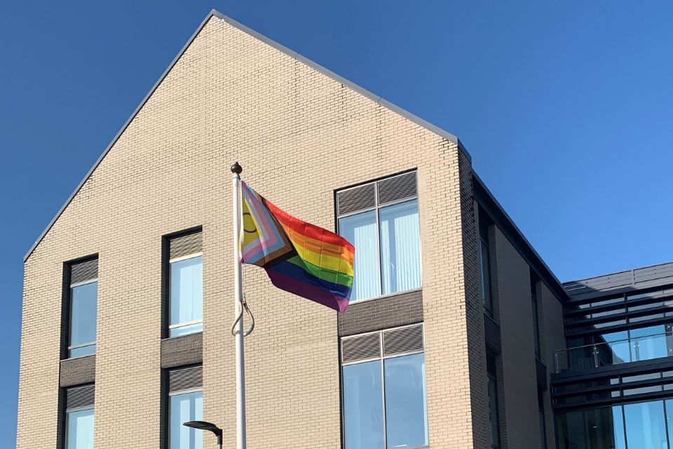 Photo of the progress pride flag flying outside EDDC's Blackdown House headquarters