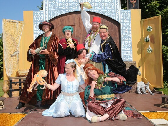 Photo of Rain or Shine's Comedy of Errors cast members in costume on stage 