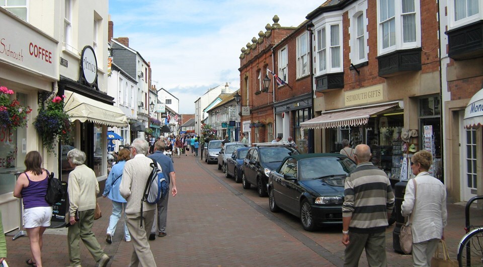 Photo of people walking past shops in Sidmouth