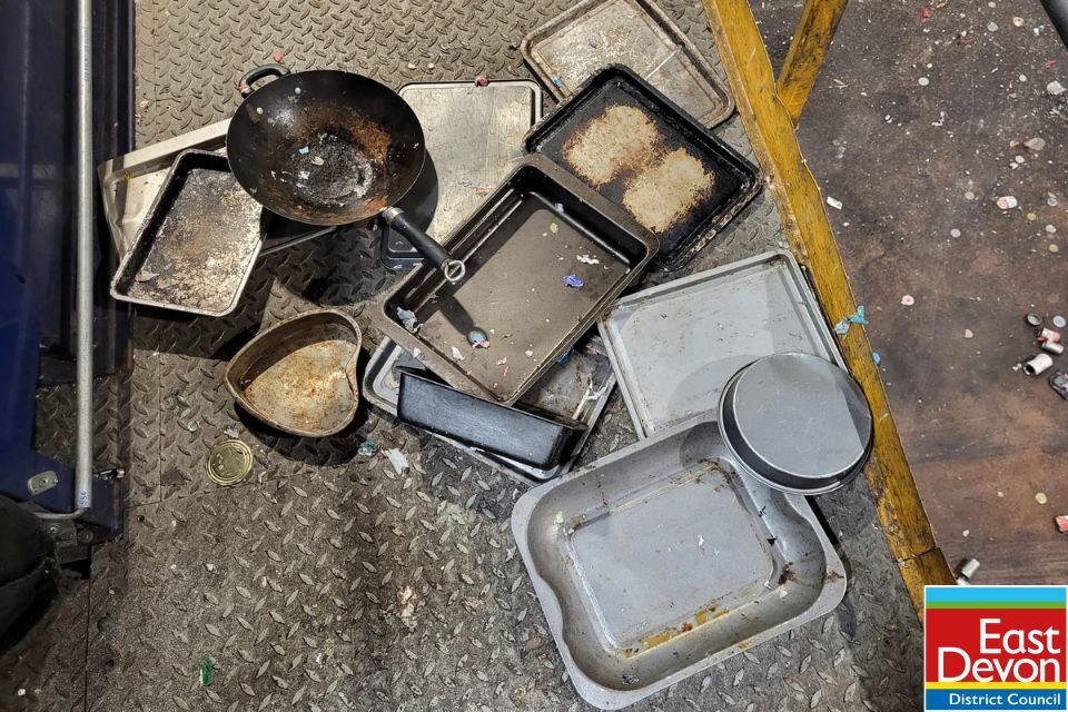 A metal frying pan and baking trays