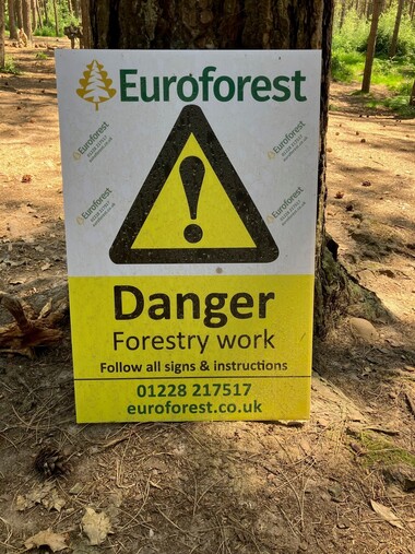 A photo with a sign about Forestry operations