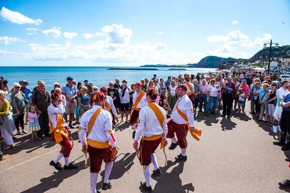 Dancing on Sidmouth seafront. Image: Arts and Culture East Devon team and arts champions - credit © Simon Tutty