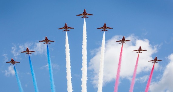 Photo of the Red Arrows flying with blue, white and red trails