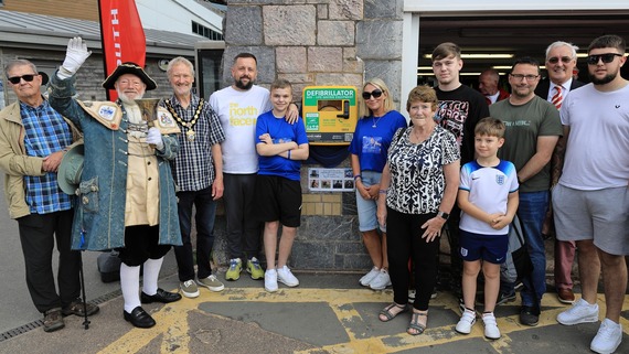 Photo from the unveiling of the new defibrillator at Exmouth Rowing club