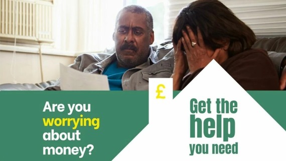 Are you worrying about money? Get the help you need. Photo of a person looking at a piece of paper sat next to a person with their head in their hands
