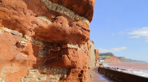 Photo of Sidmouth's Millennium Walk, with the cliff to the left and the sea to the right 