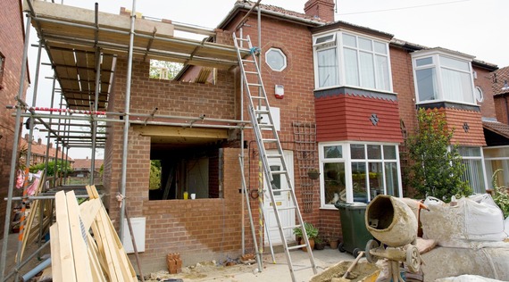 Scaffolding on an extension to a 1930s semi-detached house