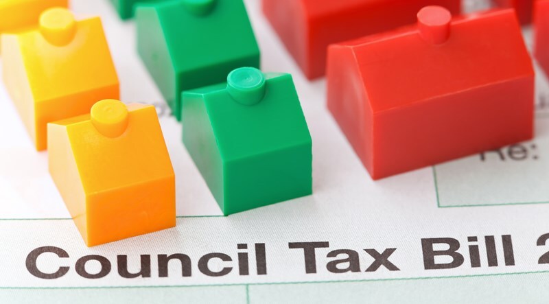 photo-of-council-tax-bill-with-yellow-green-and-red-monopoly-houses-on-top
