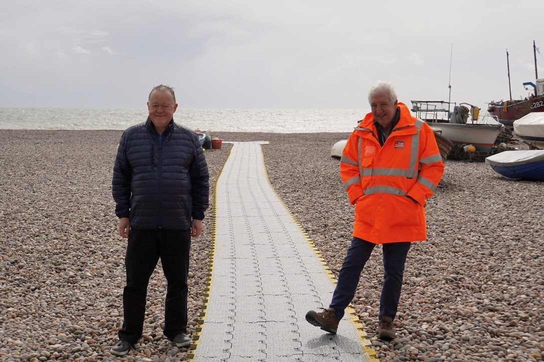Councillor John Heath, with Councillor Geoff Jung, on the new matting at Beer beach