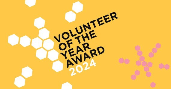 Volunteer of the year award 2024. Yellow background with white and pink hexagons
