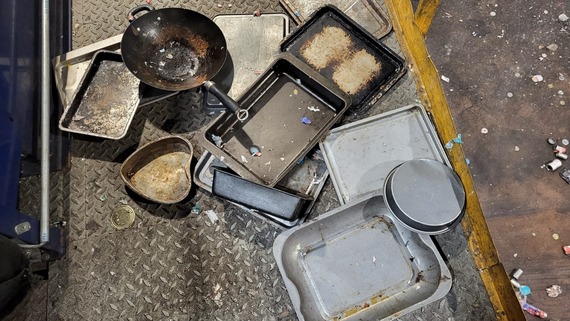 Photo of baking trays and pans found in recycling sacks by East Devon District Council