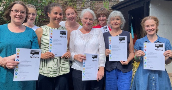 Thelma Hulbert Gallery staff and volunteers hold carbon literacy certificates
