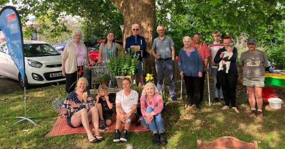 The Friends of Orchard Close, group of Sidford residents stood and sat together