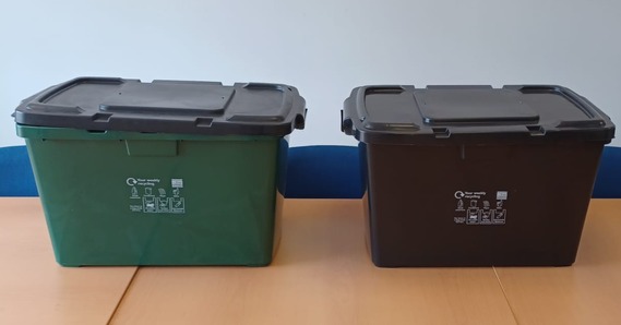 Green and black recycling boxes