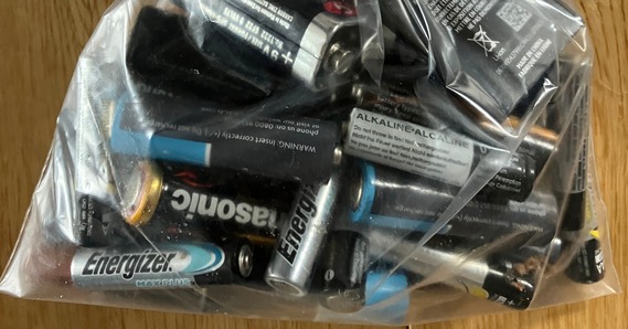 Plastic bag full of batteries