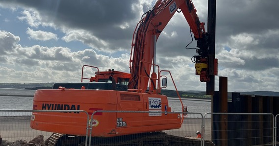 A steel sheet pile wall being installed on Exmouth seafront, during the first phase, in April 2024