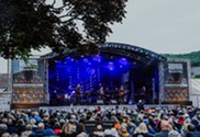 An outdoor stage performance at Sidmouth International Jazz and Blues Festival