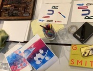 Art equipment and sketchbooks on a table