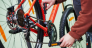 A person inspects a bike