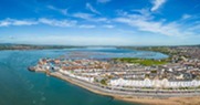Aerial view of Exmouth in the foreground and the Exe Estuary in the background