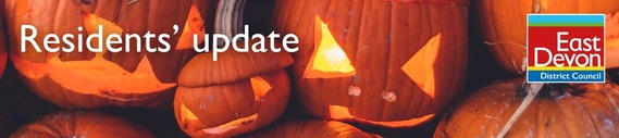 Residents' Update. Carved pumpkins lit up. East Devon District Council logo