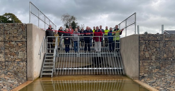Councillors, partners and community representatives mark the official completion of the Feniton Flood Alleviation Scheme