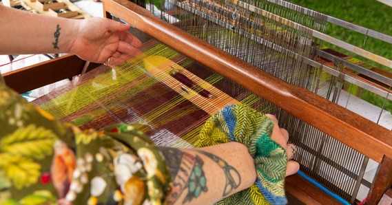 Two hands weaving