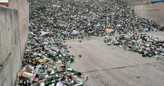 A pile of glass items at a recycling depot
