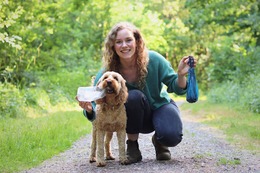 Alice and dog Alfie from Pet Impact collection rubbish and picking up dog poo