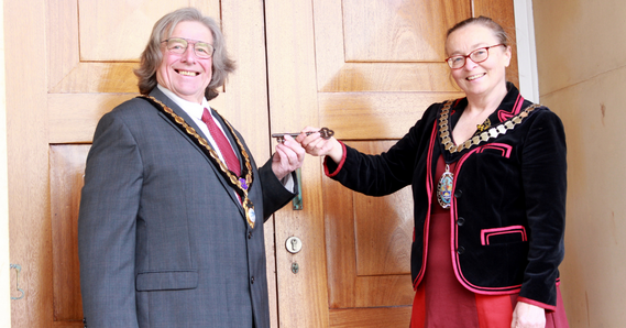 East Devon District Council Chair, Councillor Eleanor Rylance, ceremonially handing over the keys to Exmouth Mayor, Councillor Graham Deasy