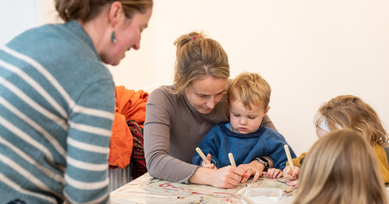 Adults and children at a family workshop