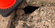 Hole with cone next to it