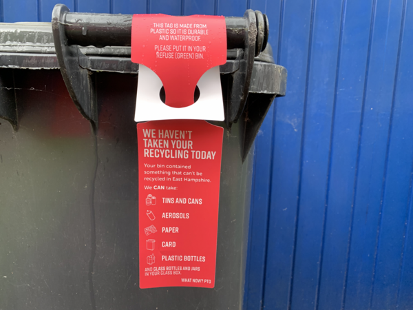 Bin hanger on recycling bin