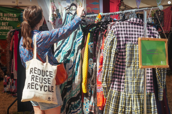 Woman shopping in Oxfam shop