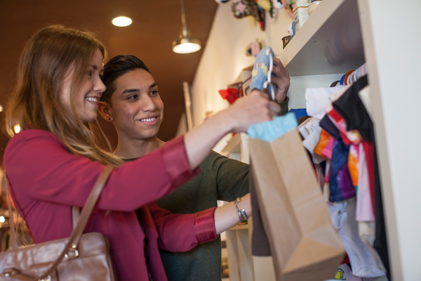 Two people shopping in a charity shop